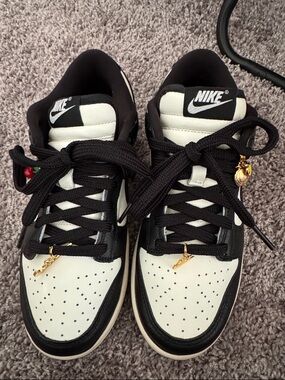 Nike Black and White Low-Top Sneakers with Gold Accents